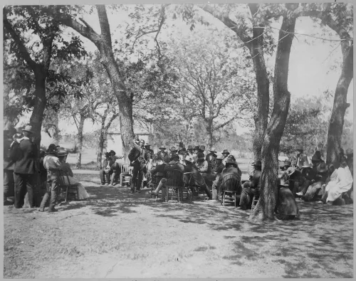 Council of Cheyenne and Arapaho at Seger Colony, Oklahoma, with an agent, 1900 #52