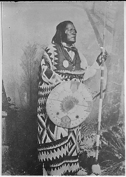 San Juan, a Mescalero Apache chief; standing, full-length, holding a spear and shield #122