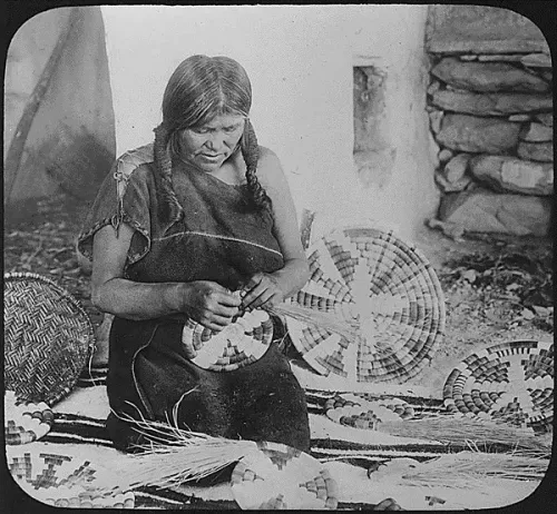 Hopi woman weaving a basket #40